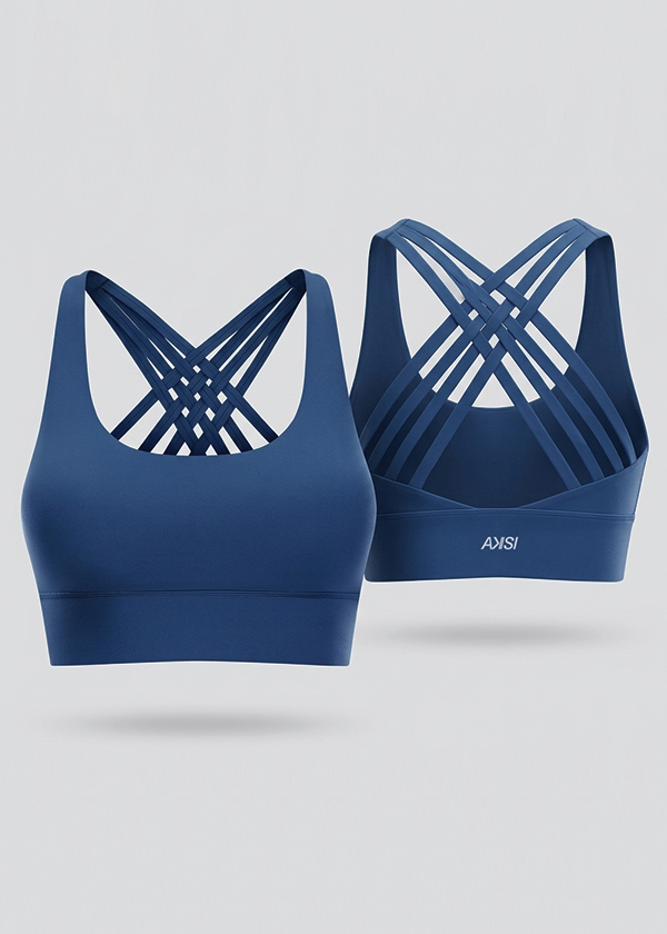 Two blue sports bras with criss-cross straps on a light gray background